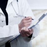 Doctor Writing on Clipboard